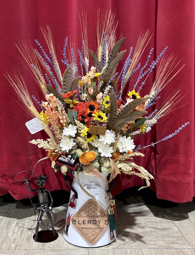 Flowers from John and Jamie, Travis, Madilyn, Oric, Joshua, Emily, Ruby, and Larissa Dolezal