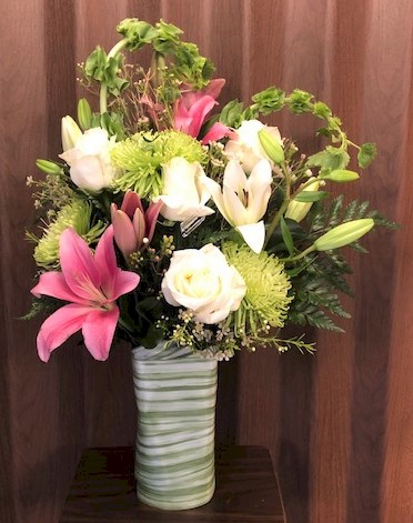 Flowers from Mike and Melissa Buzza; Caitlyn, Justin, and Llyian Koser; and Henry and Mary Buzza