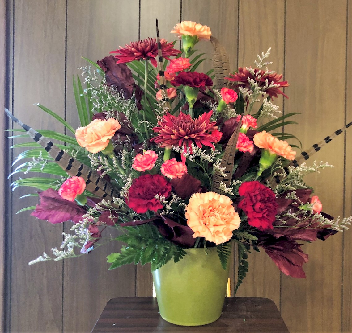Flowers from Mike and Marie Naescher; John and Twilla Naescher; Leroy Naescher; and Bruce and Cleone Cozine