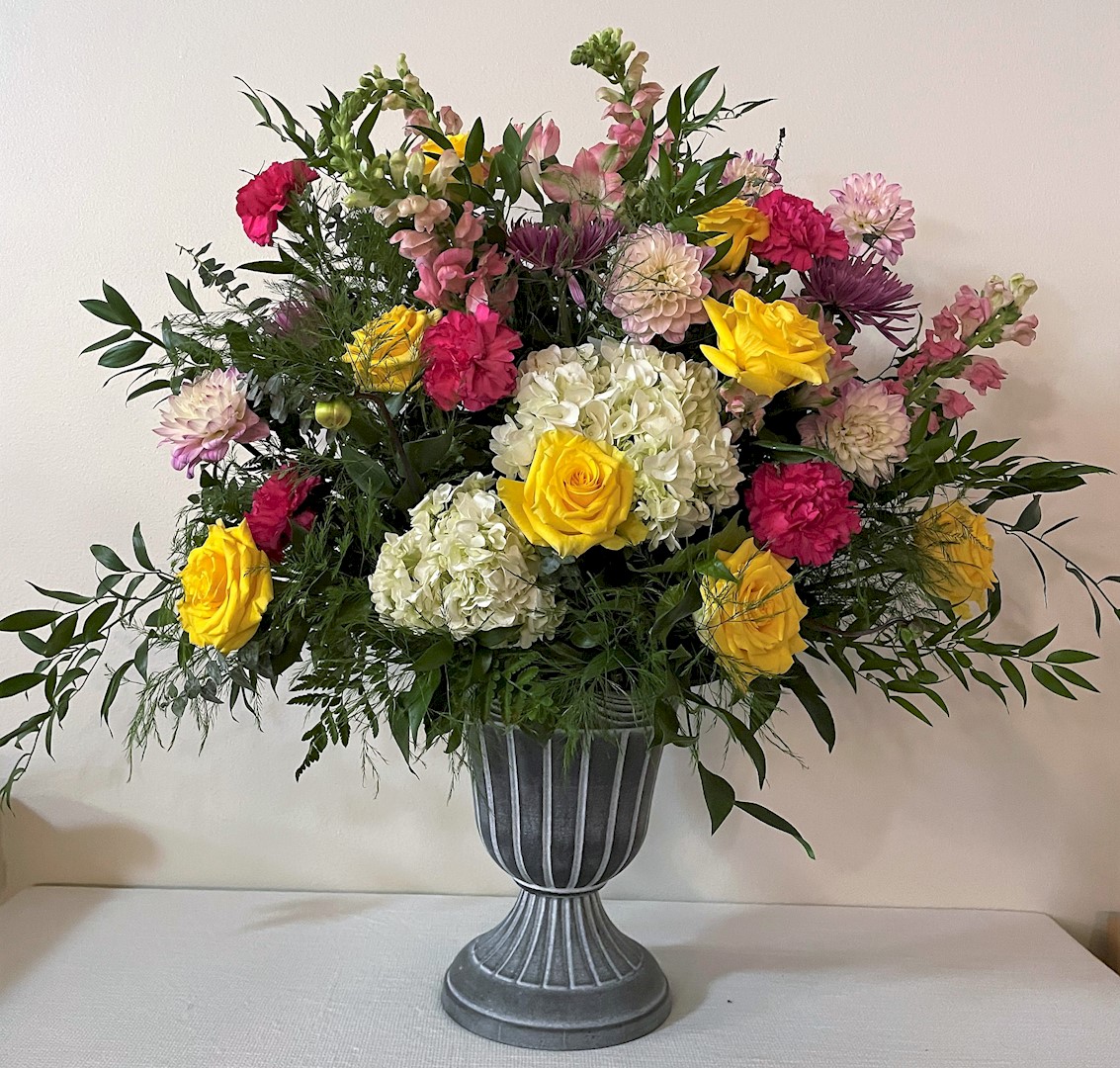 Flowers from Kay Nikodym; Dan, Lori, Andrew, and Leah; and David and Rowan
